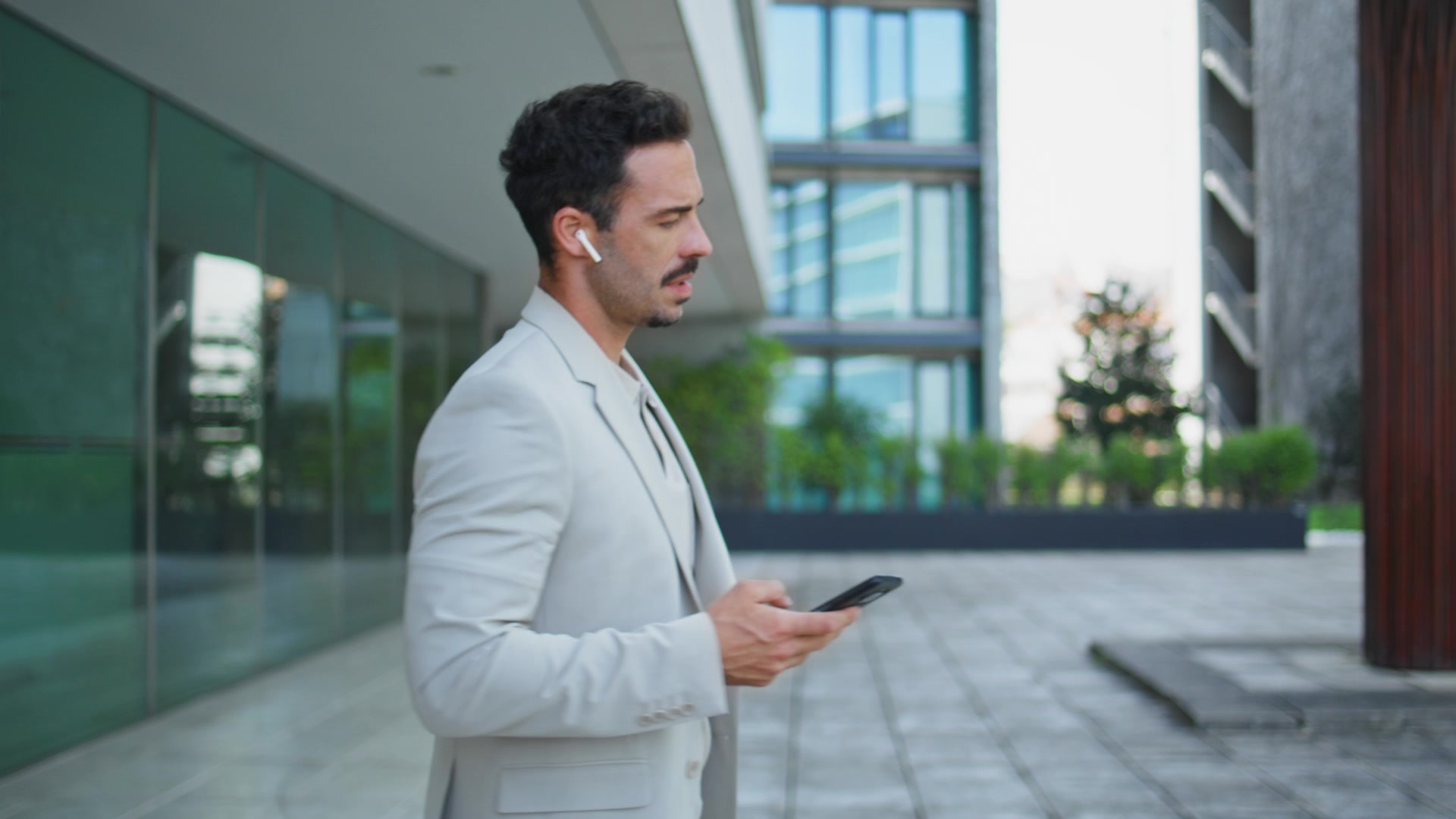 A listener using a phone while moving through the day